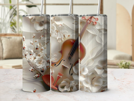 Violin and floral design on a cylindrical tumbler.