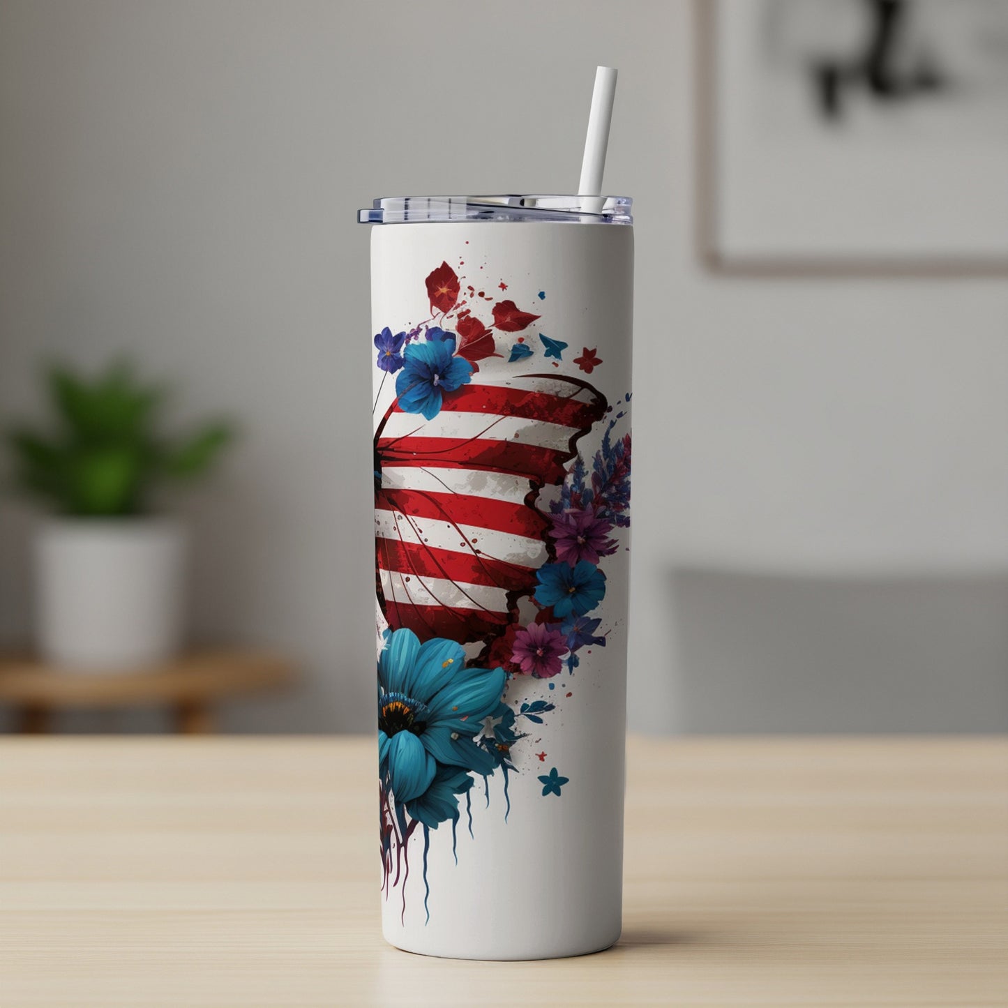 White tumbler with American flag butterfly and blue flowers.