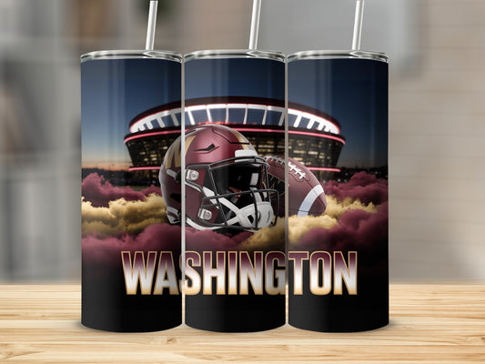 Washington football helmet and ball against stadium backdrop with clouds.