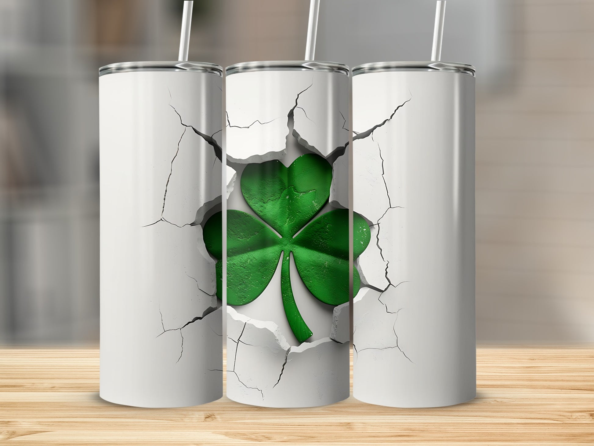 White tumbler with cracked-open design revealing a green shamrock.