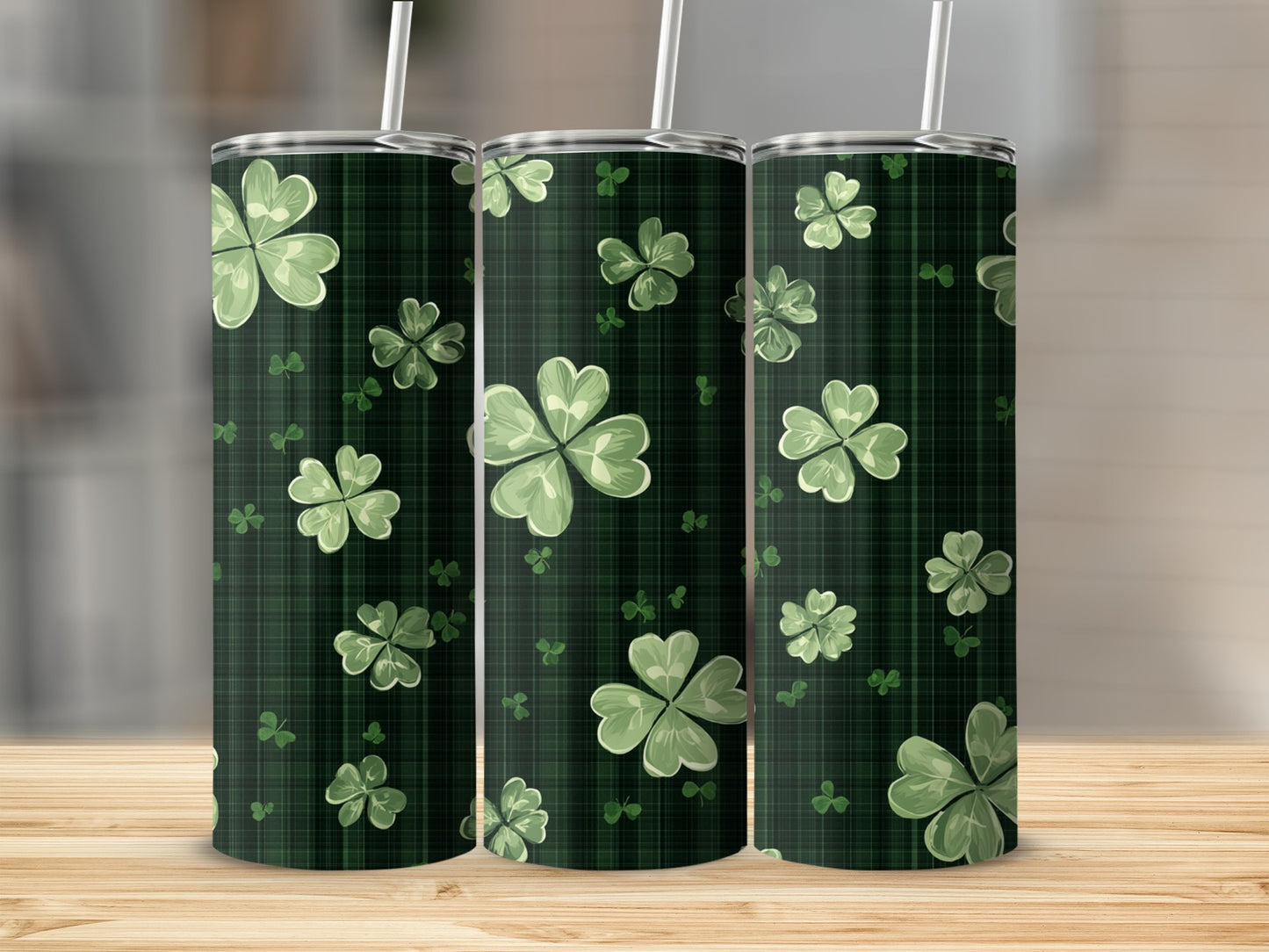 Three green plaid tumblers with clover leaf pattern.