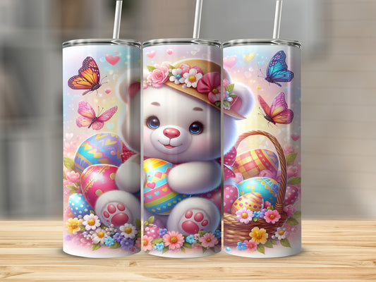 Easter teddy bear holding an egg with butterflies and decorated Easter eggs.