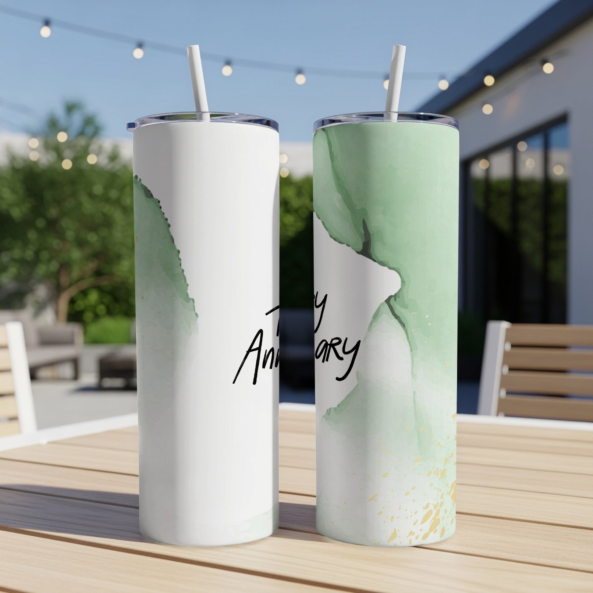 Two tumblers with green watercolor and gold accents, one with "Happy Anniversary" text.
