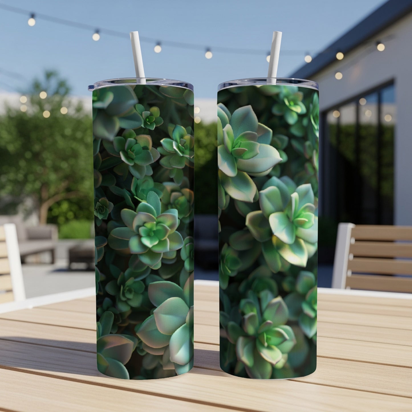 Two tumblers with green succulent plant pattern on a wooden table.