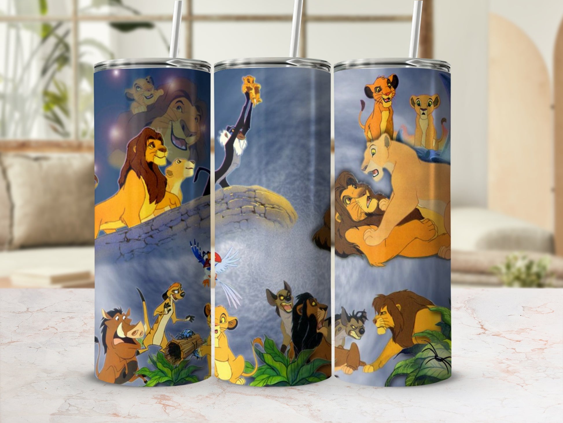 The Lion King characters on a tumbler with a straw.