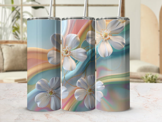 Three tumblers with pastel floral and rainbow abstract designs.