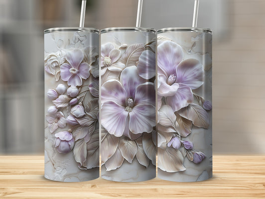 Three tall tumblers with embossed floral designs in shades of purple and white.
