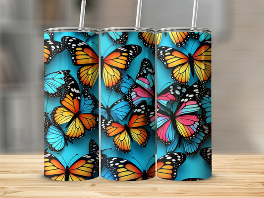 Three tumblers with colorful butterflies on a blue background.