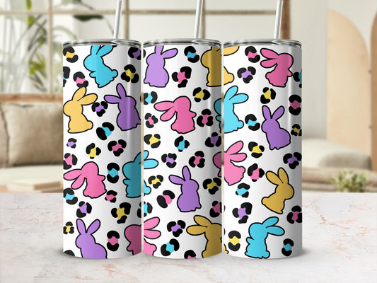 Three colorful bunny-themed tumblers with leopard print accents.
