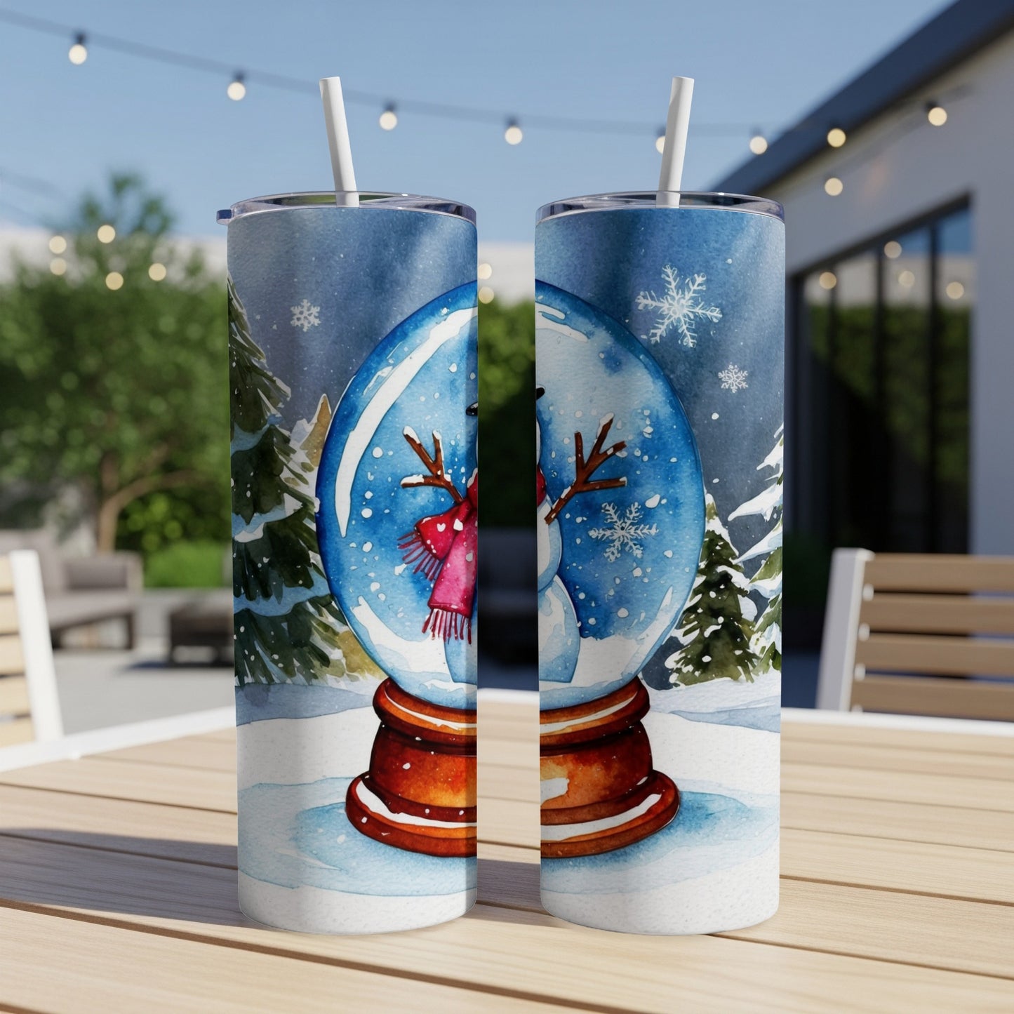 Snow globe tumbler with snowman and winter scene.