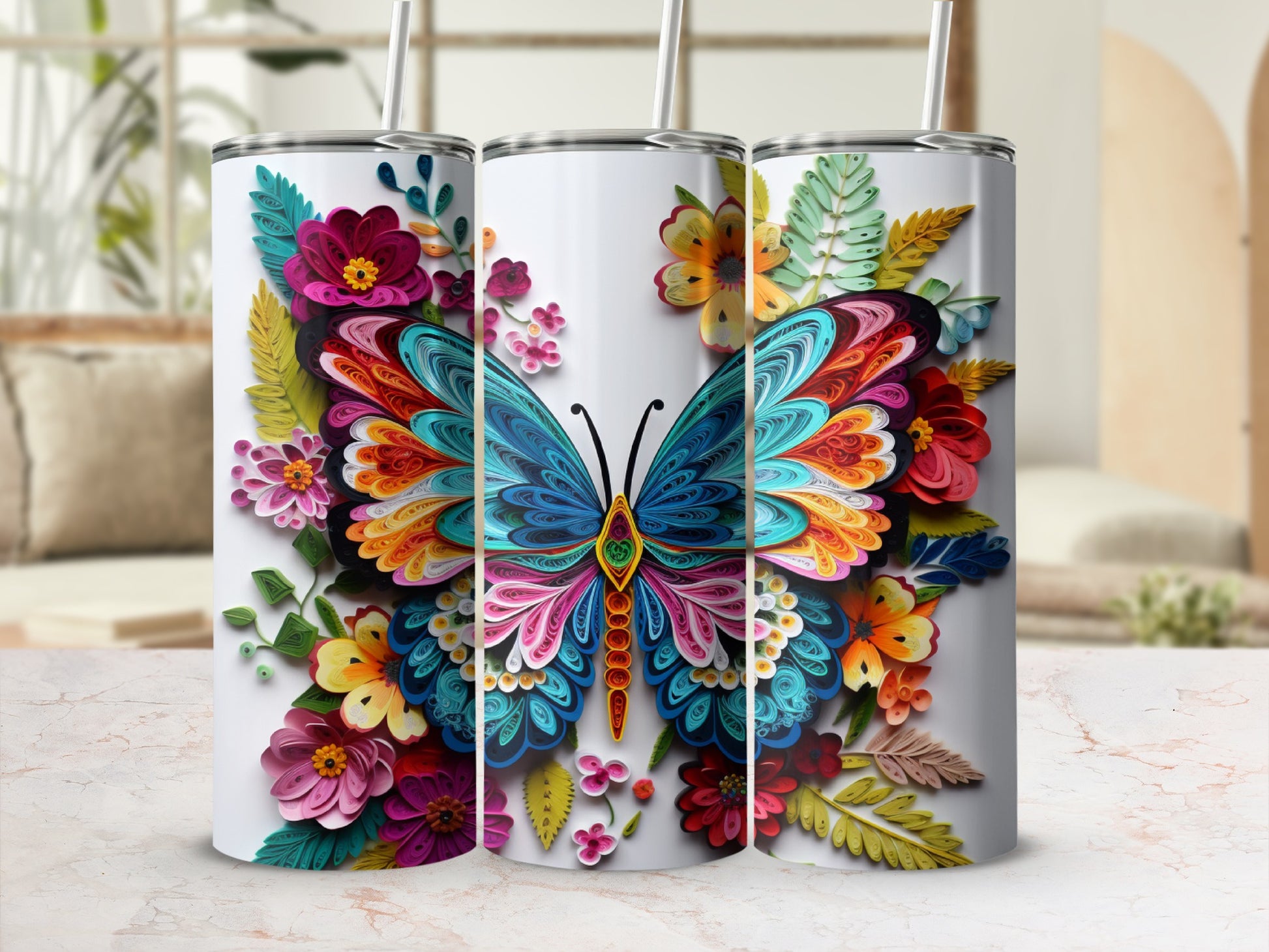 Three tumblers featuring a colorful butterfly and floral design.