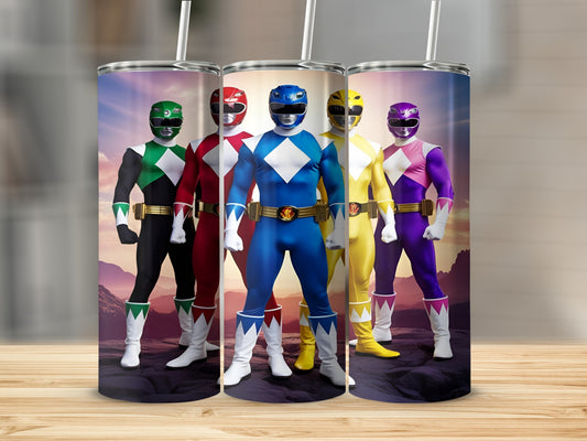 Five Power Rangers in full costume standing in a line against a rocky landscape.