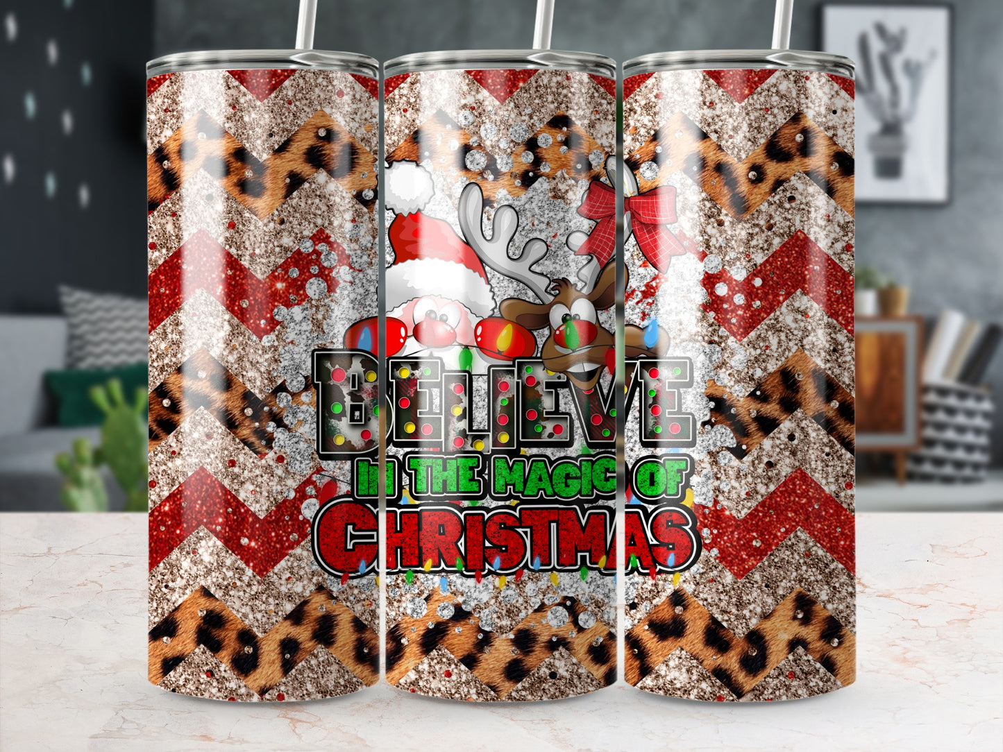 Christmas tumbler with Santa, reindeer, and "Believe in the magic of Christmas" text.
