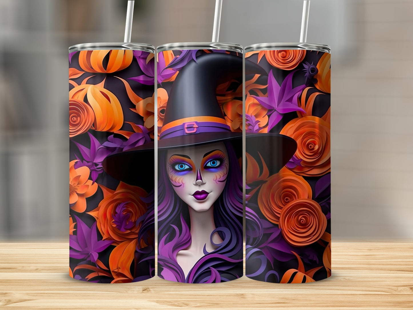 Three tumblers with Halloween design featuring a witch and paper flowers.