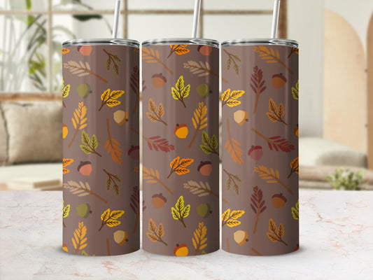 Three brown tumblers with falling autumn leaves and acorns pattern.