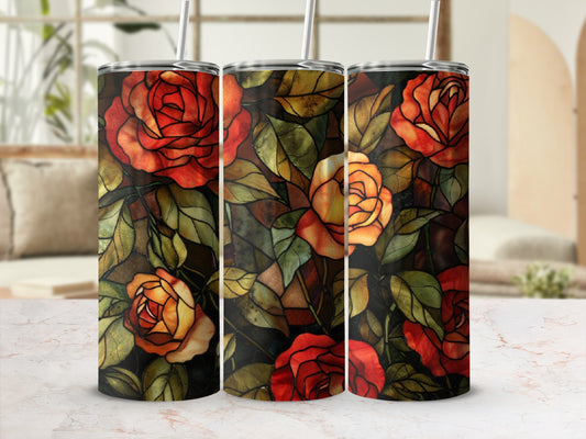 Three tumblers with a stained glass rose floral design and reusable straws.