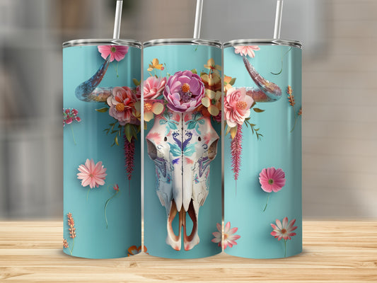 Turquoise tumbler with floral bull skull design and pink flowers.