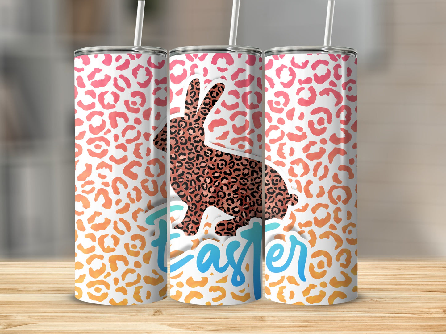 Easter bunny with leopard print and ombre background on three tumblers.