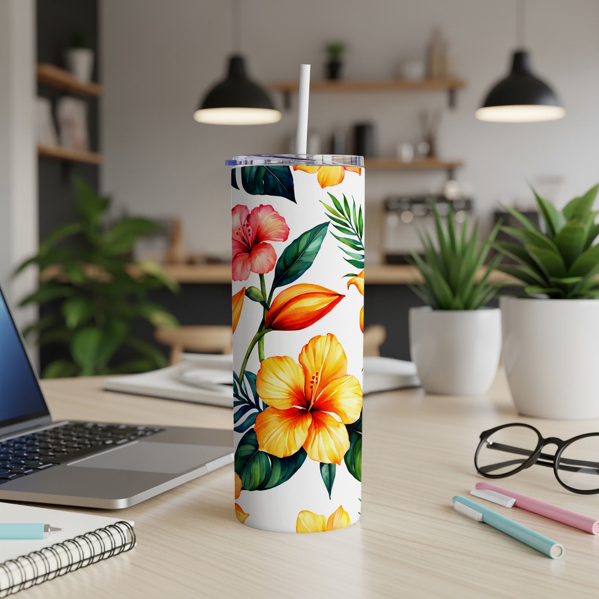 White tumbler with a vibrant tropical floral pattern of hibiscus flowers.