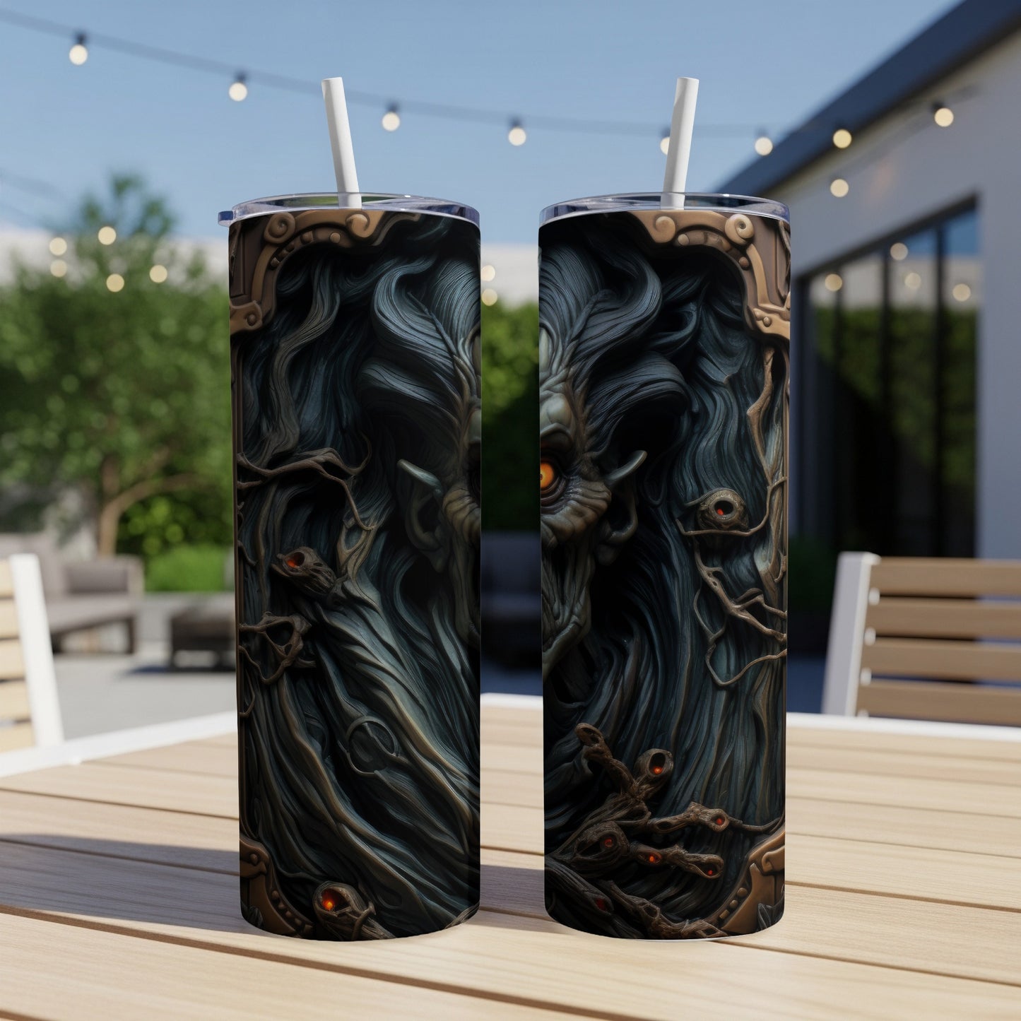 Two tumblers with a dark, gothic monster design and orange eyes.