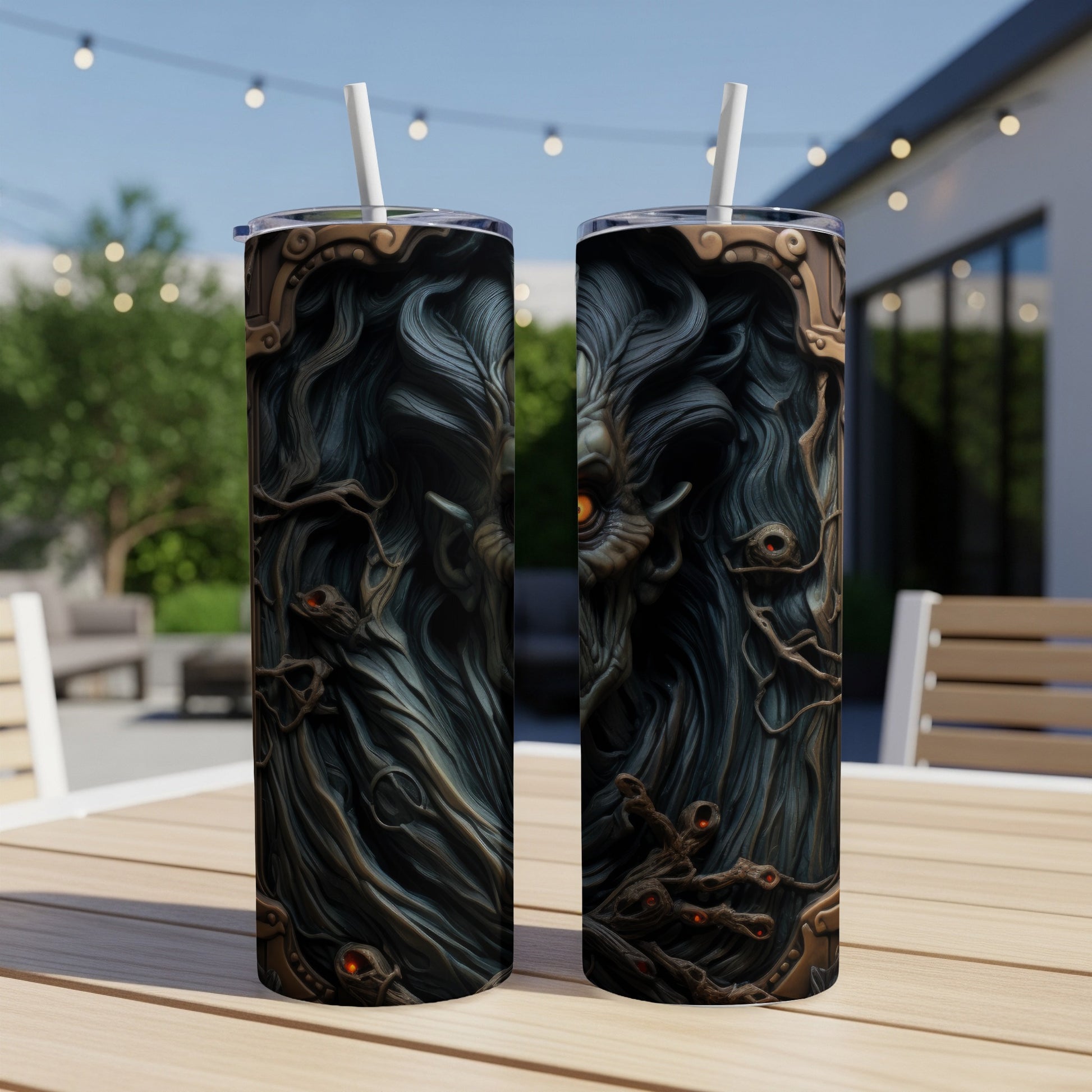 Two tumblers with a dark, gothic monster design and orange eyes.