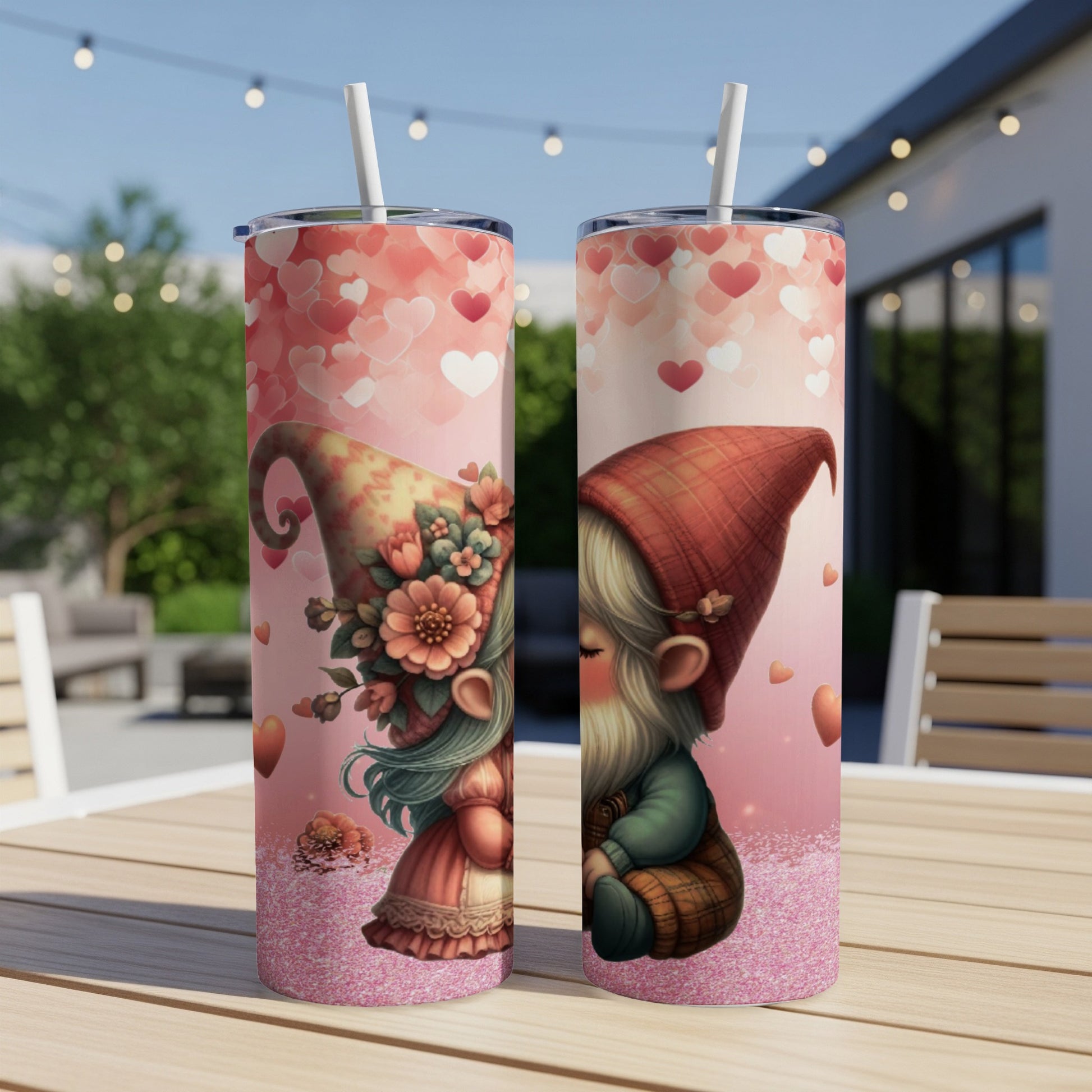 Two tumblers with gnome illustrations on a pink, heart-patterned background.