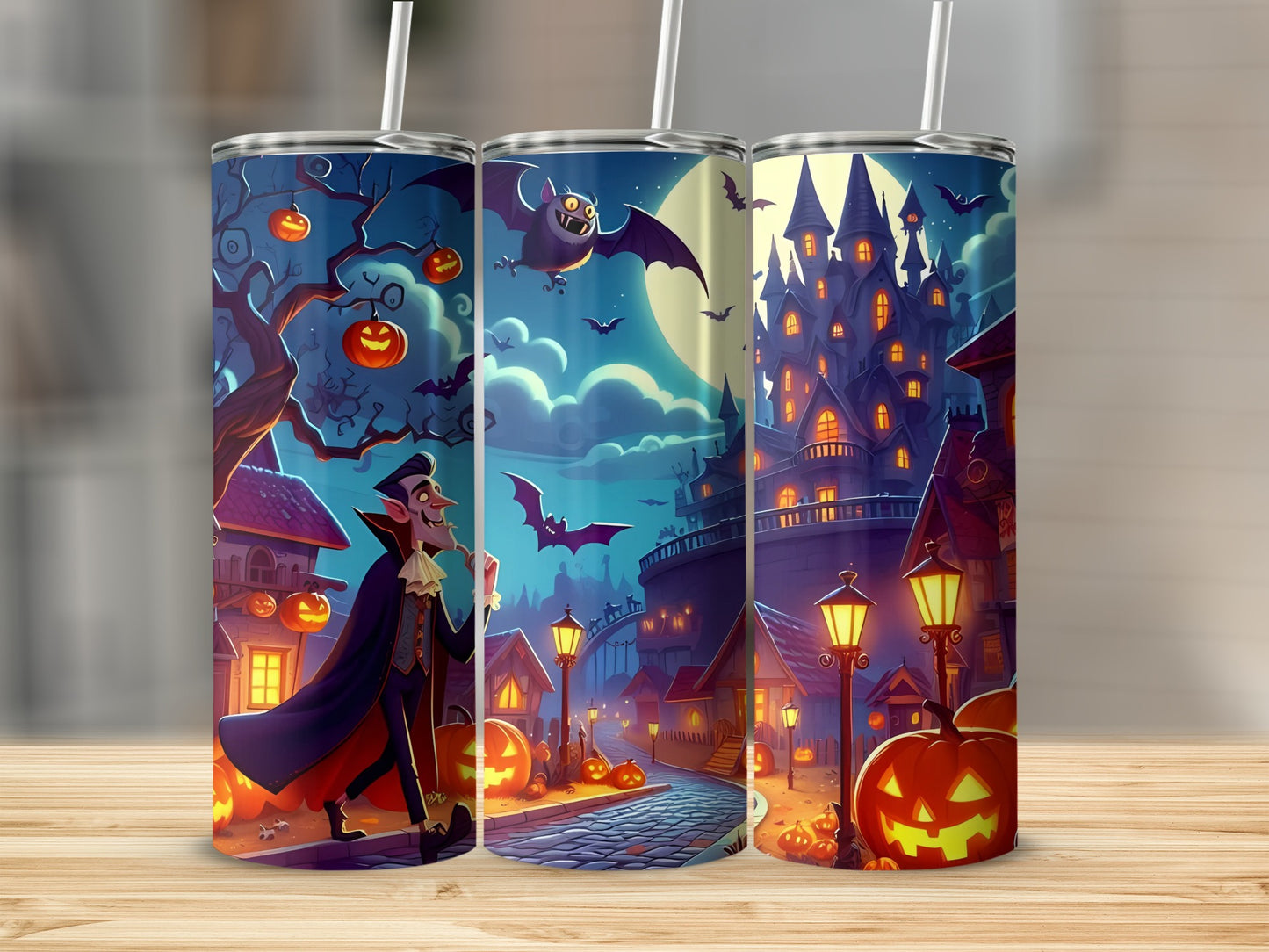 Three tumblers with a Halloween theme, featuring a vampire, haunted castle, and jack-o'-lanterns.