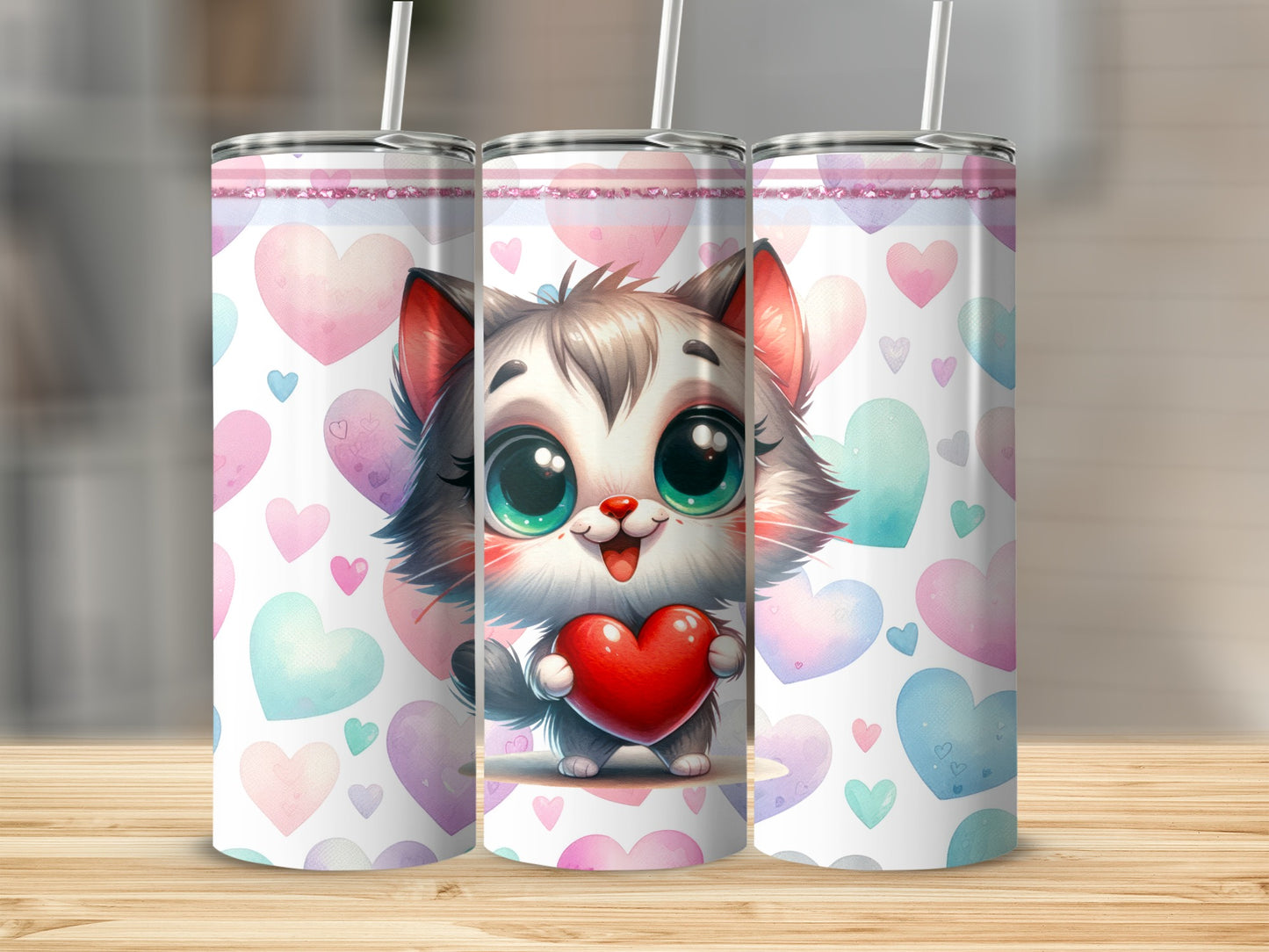 Cute kitten holding a heart on a pink and blue heart patterned tumbler.