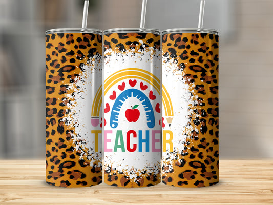 Leopard print tumbler with rainbow, apple, and pencil design, spelling "TEACHER."