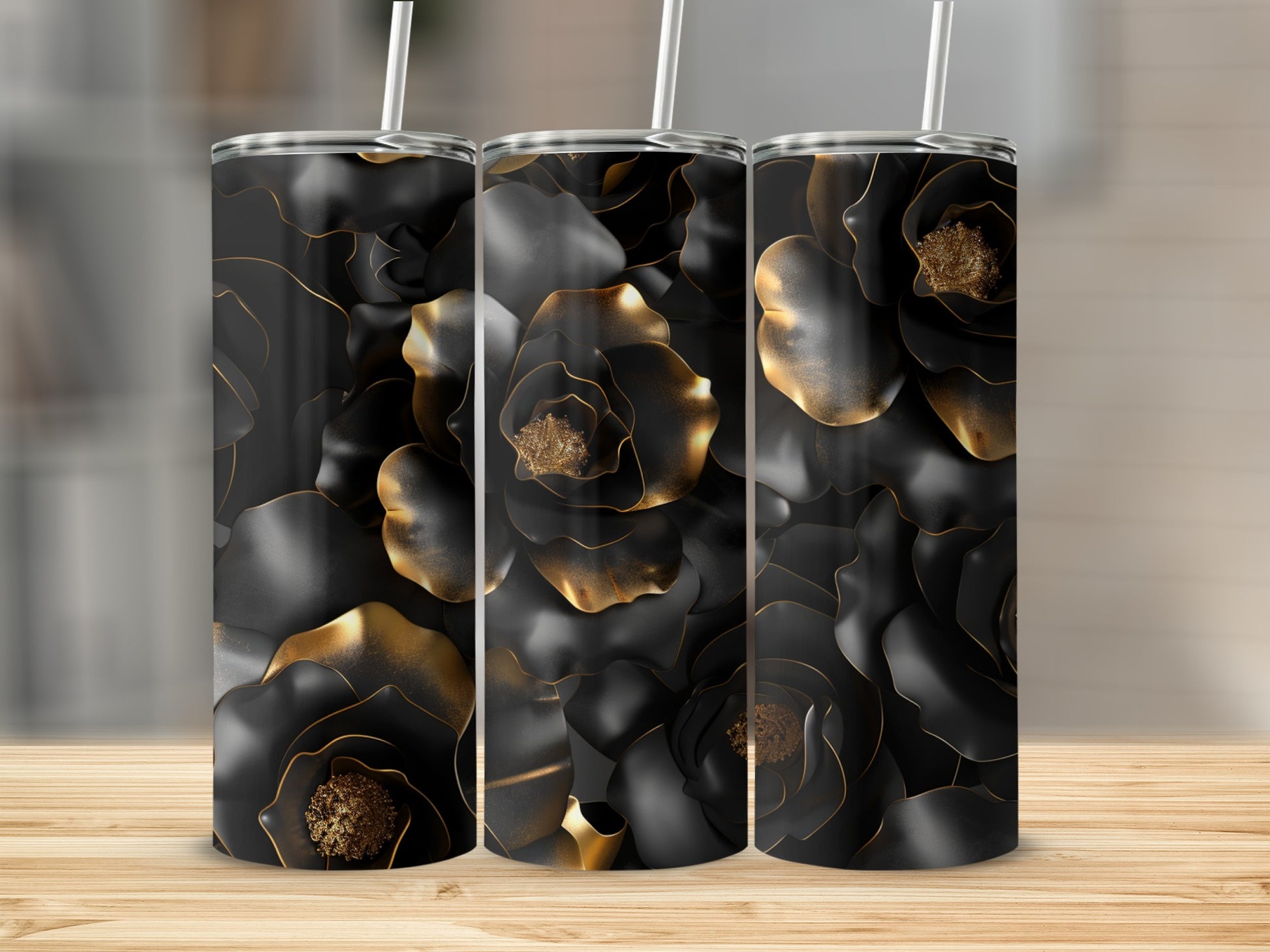 Three tumblers with black floral pattern and gold accents.