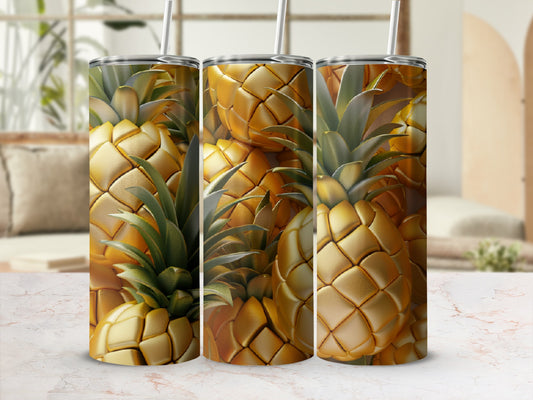 Three tumblers with a detailed golden pineapple design against a blurred background.