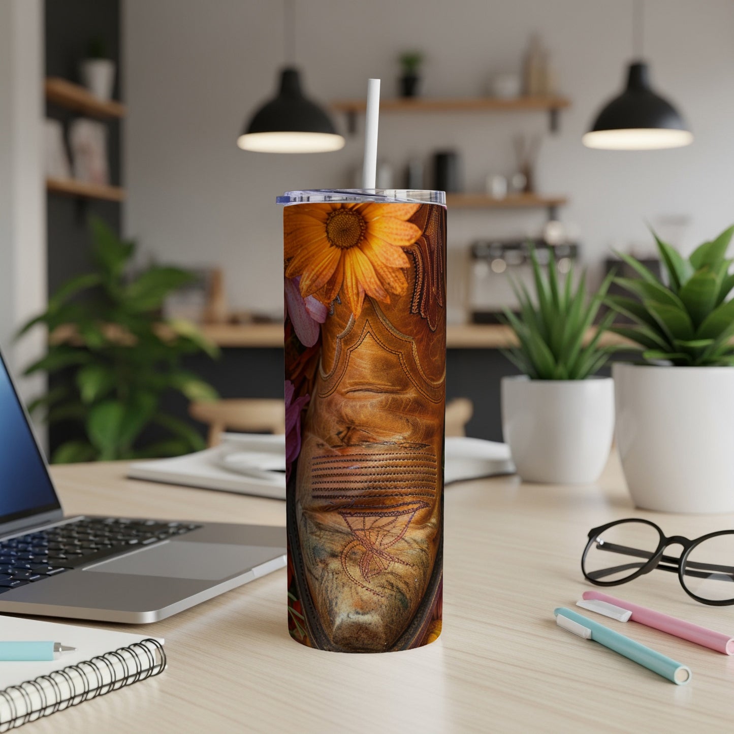Cowboy boot pattern on a tumbler with a straw.