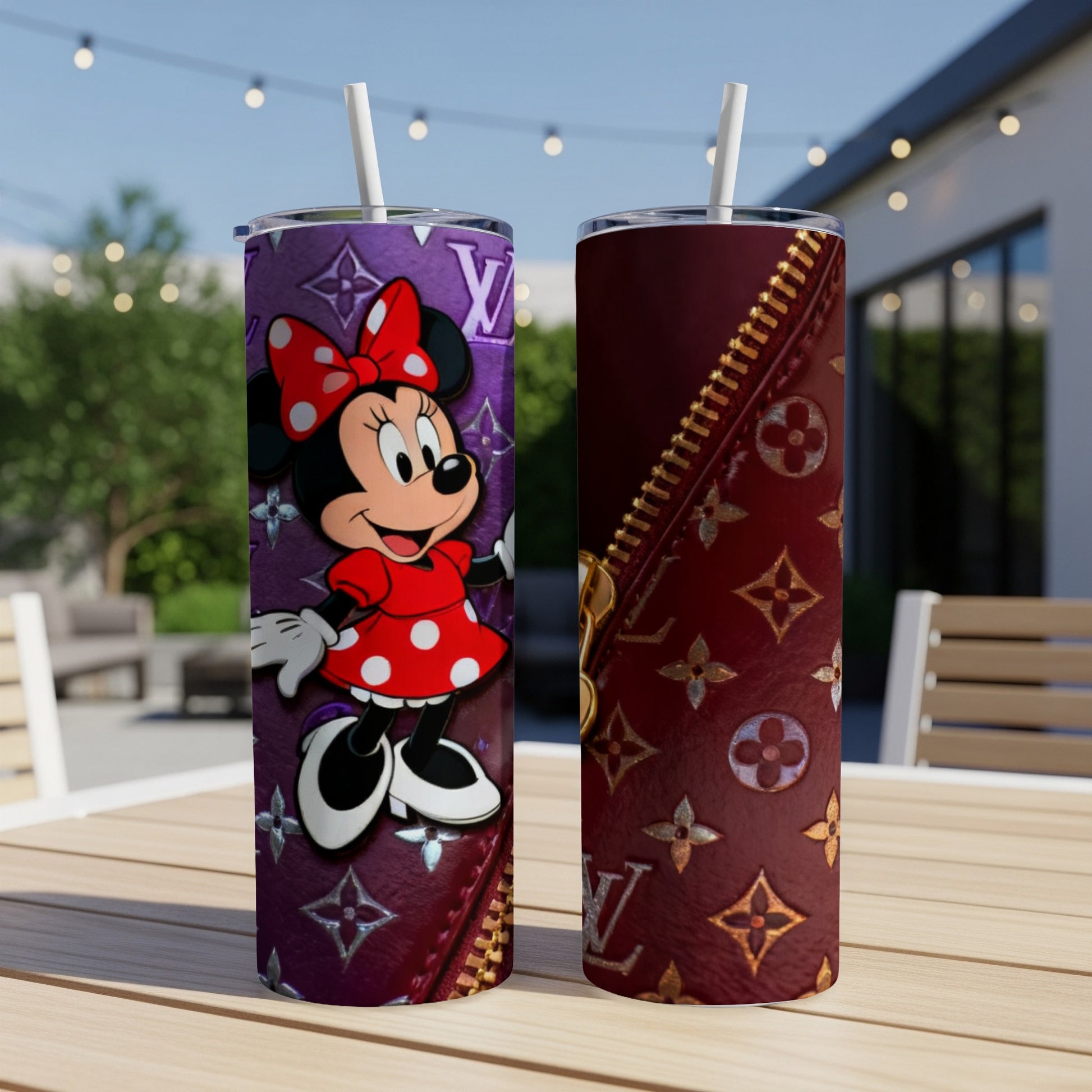 Minnie Mouse on a purple tumbler with a gold zipper detail.