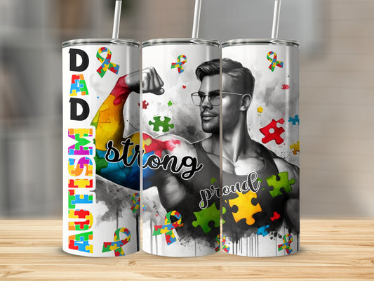 Tumbler with "Dad Strong" text and colorful autism puzzle pieces.
