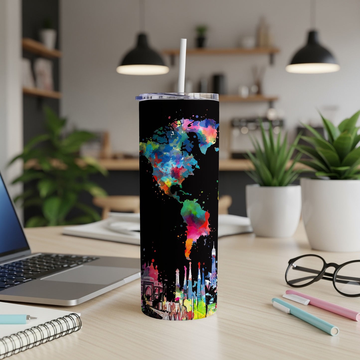 Black tumbler with watercolor Americas map and international city skylines.