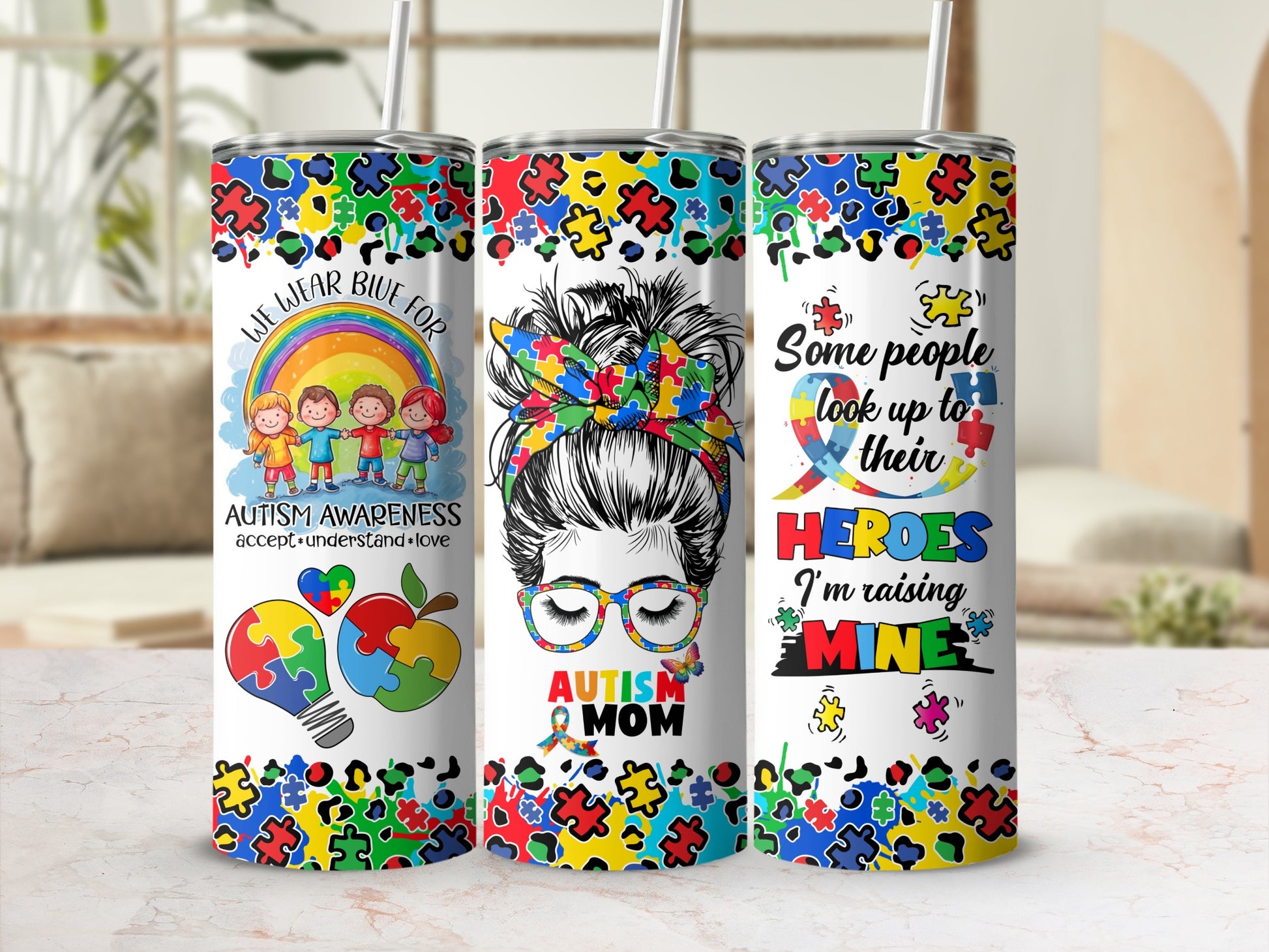 Colorful Autism Awareness tumbler with "Autism Mom" and "Heroes" text.