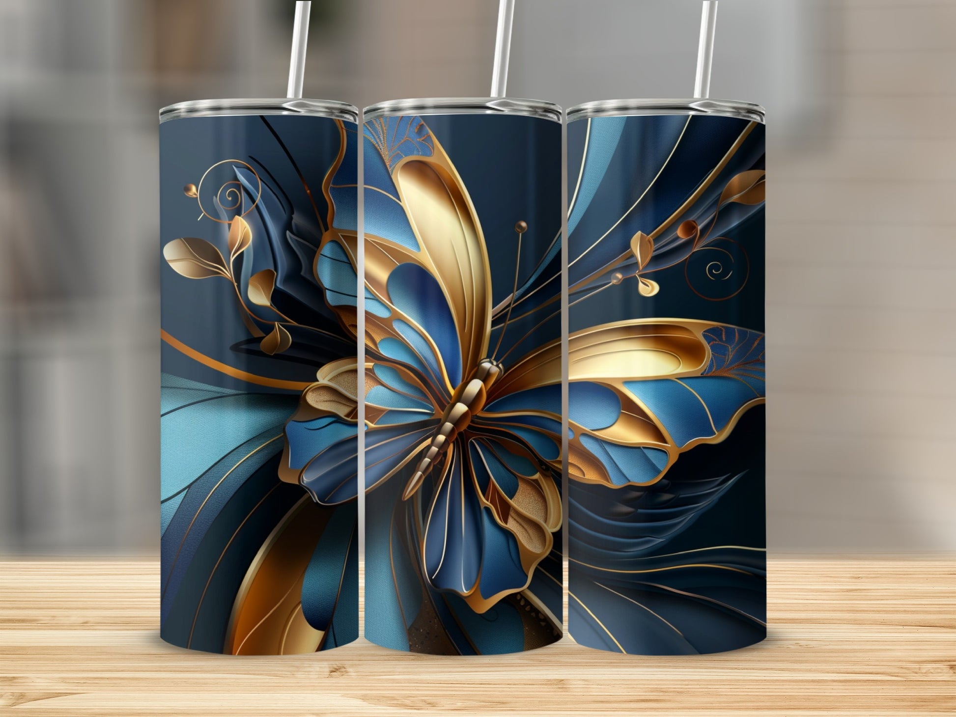 Three tumblers with a blue and gold butterfly design.