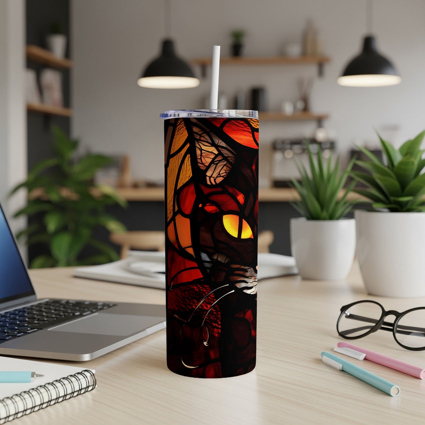 Stained glass tumbler featuring a dark cat with yellow eyes.
