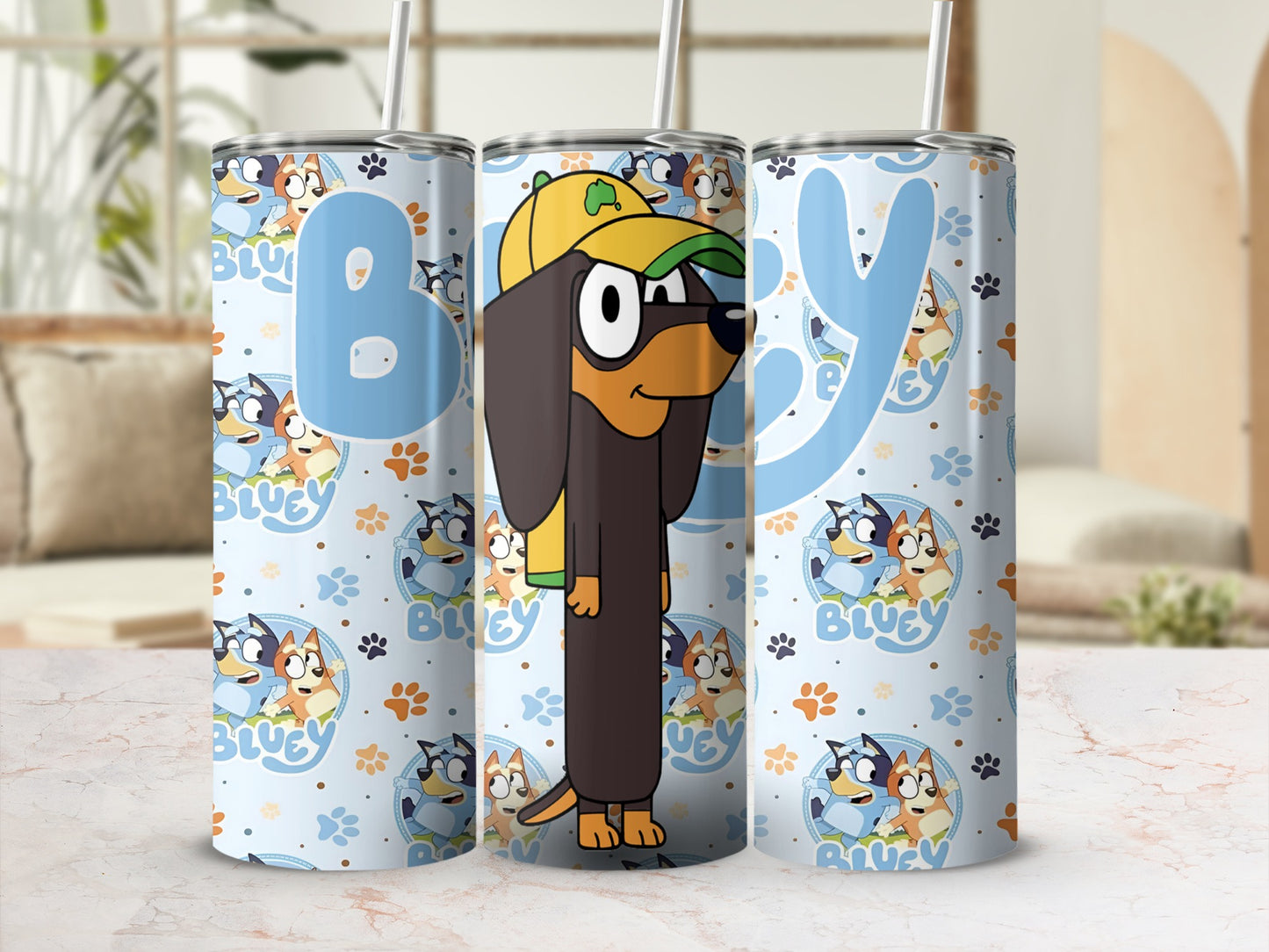 Bluey character tumbler with character pattern and blue "B" and "Y" letters.