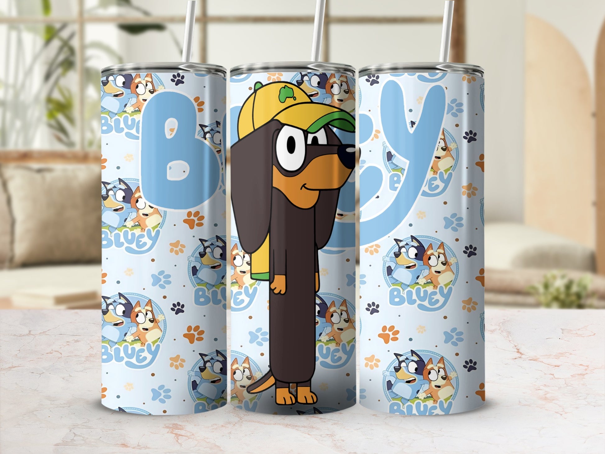 Bluey character tumbler with character pattern and blue "B" and "Y" letters.
