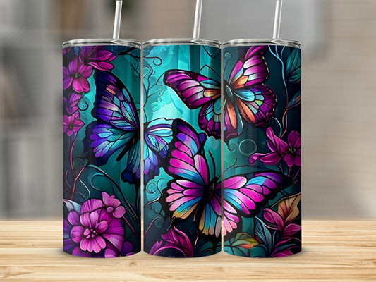 Three tall tumblers with colorful butterfly and floral designs.