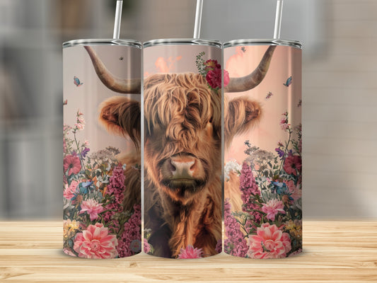 Highland cow with flowers and butterflies on a tumbler.