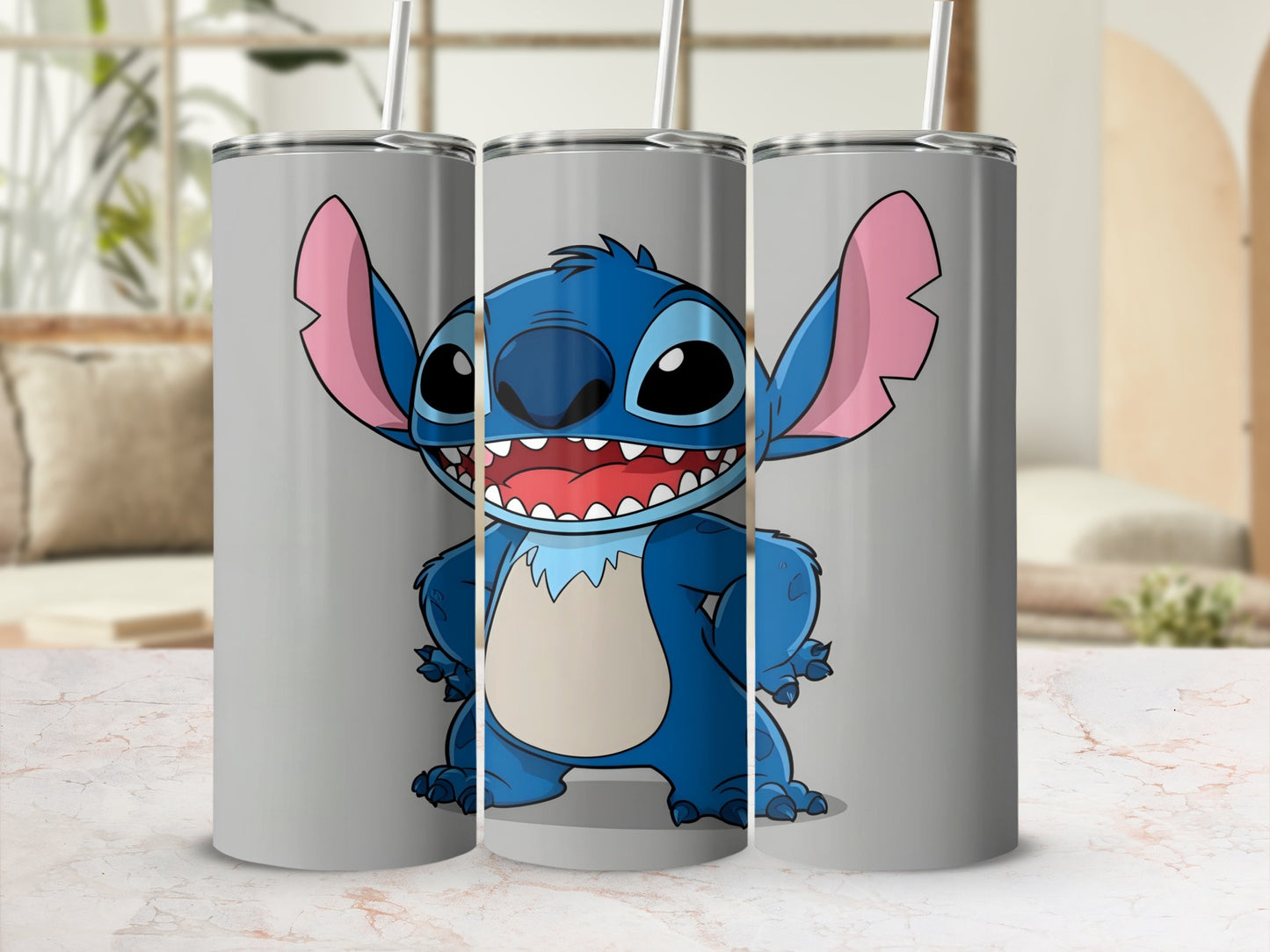 Three gray tumblers featuring Stitch from Lilo & Stitch with a playful expression.