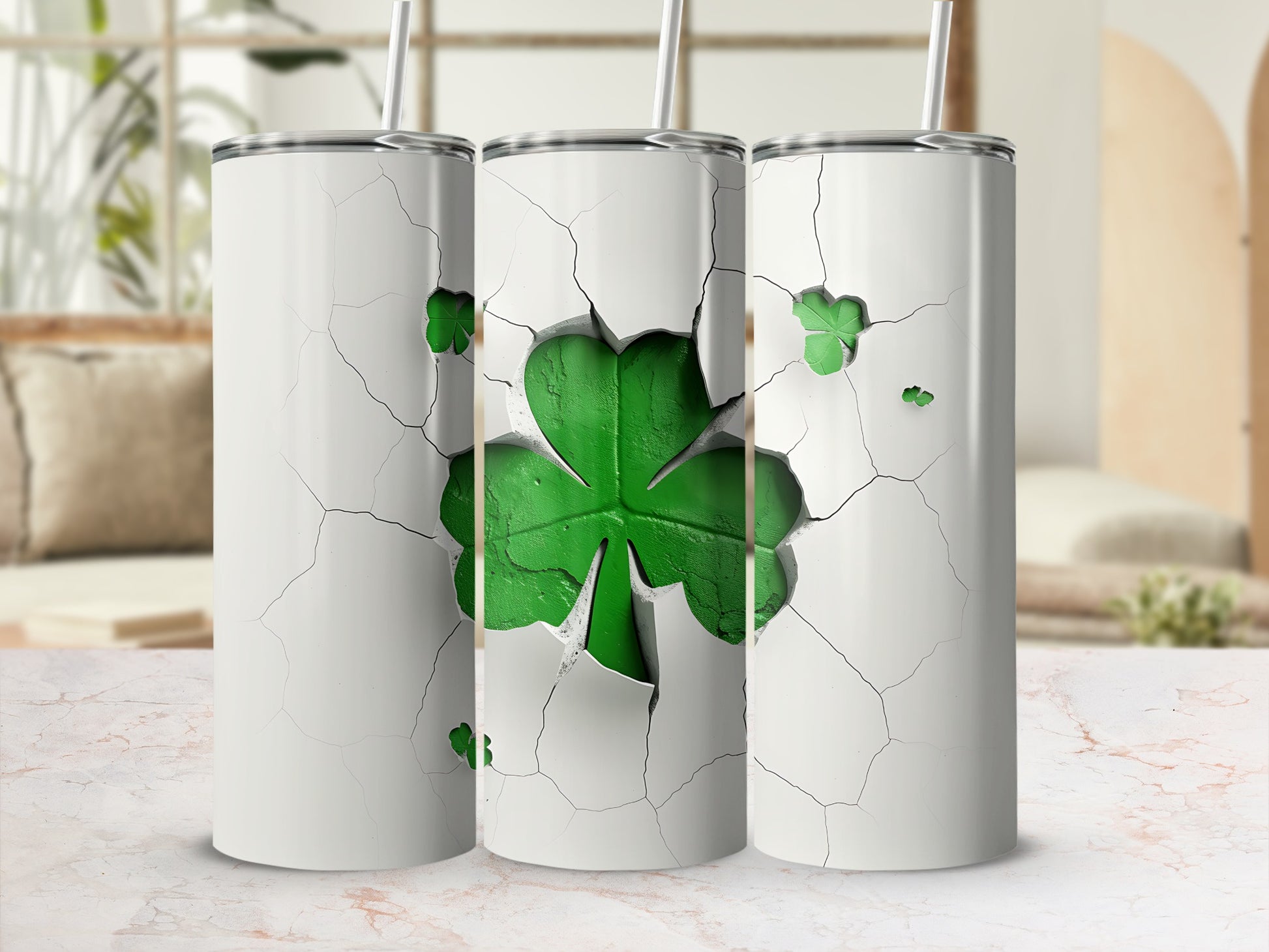 Three white tumblers with cracked surfaces revealing a green shamrock design.