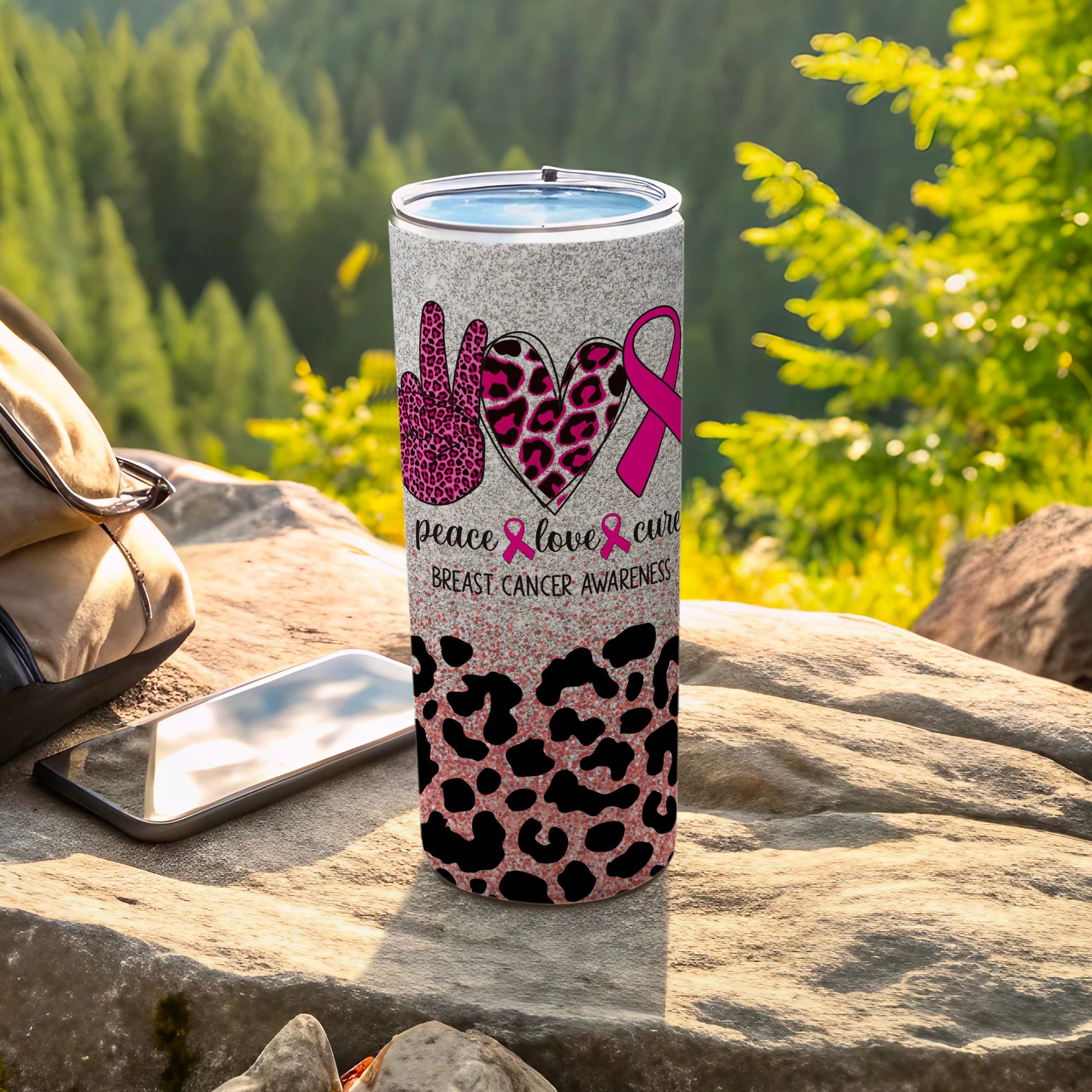 Tumbler with peace sign, pink ribbon, and leopard print, saying "Peace, Love, Cure, Breast Cancer Awareness".