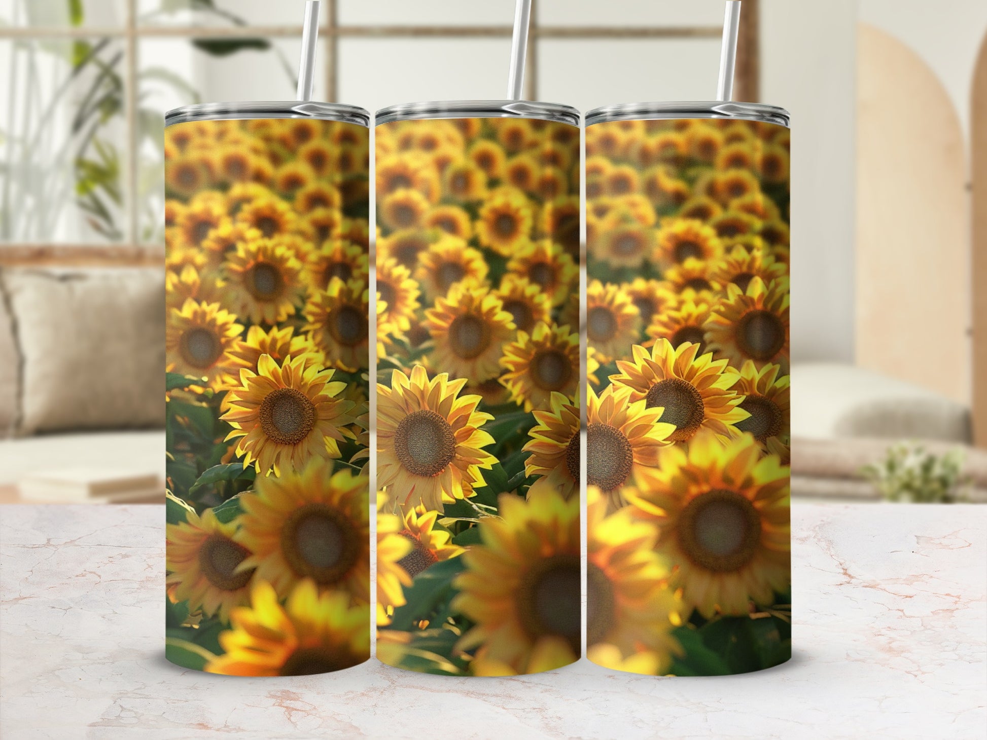 Three tumblers featuring a blurred, close-up sunflower field design.