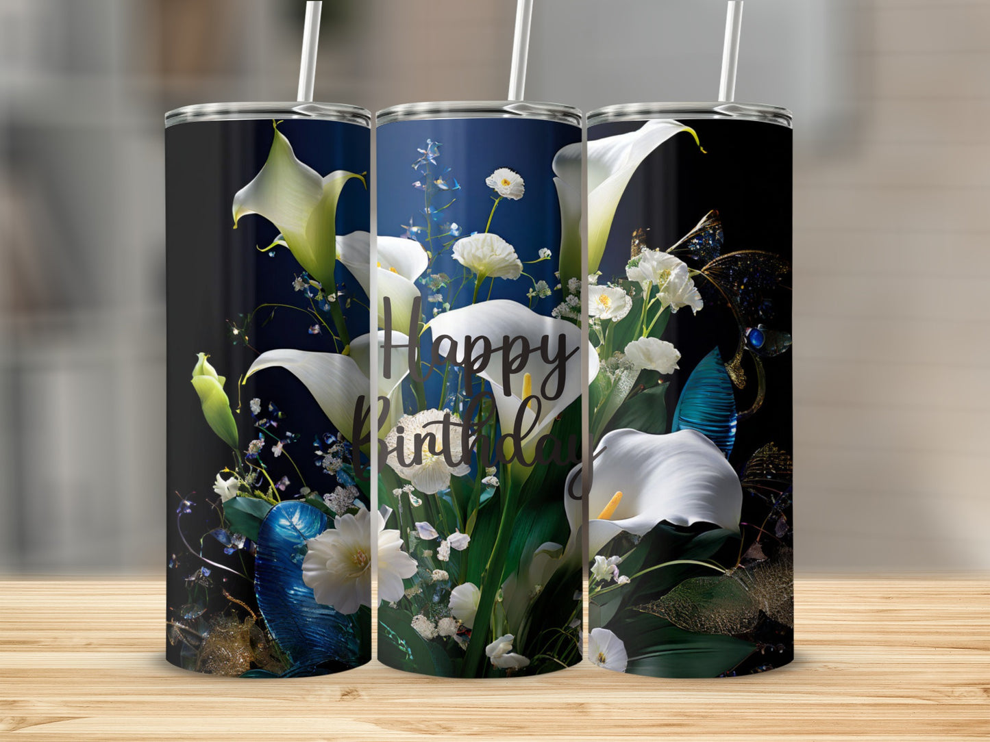 White calla lilies and baby's breath adorn a tumbler with "Happy Birthday" text.