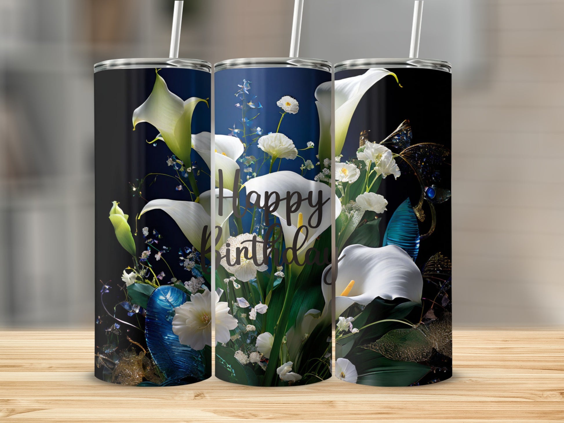 White calla lilies and baby's breath adorn a tumbler with "Happy Birthday" text.