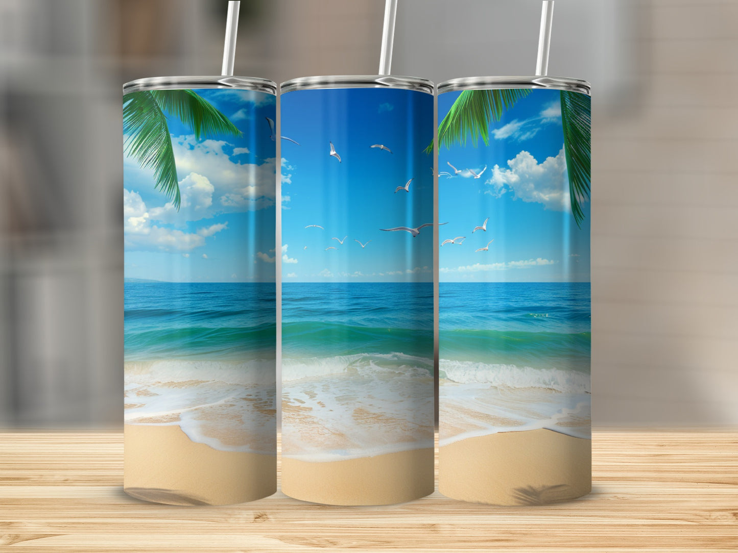 Three tumblers with beach scene, palm trees, ocean, and seagulls.