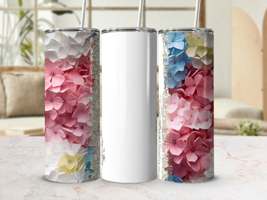 Pink, white, and blue hydrangea flowers decorate a blank white tumbler.